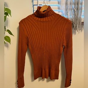 Woman’s turtleneck.